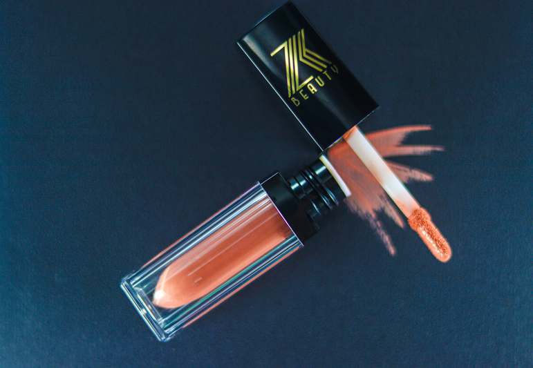 Assortment of high-quality lip brushes neatly arranged on a marble surface with soft lighting